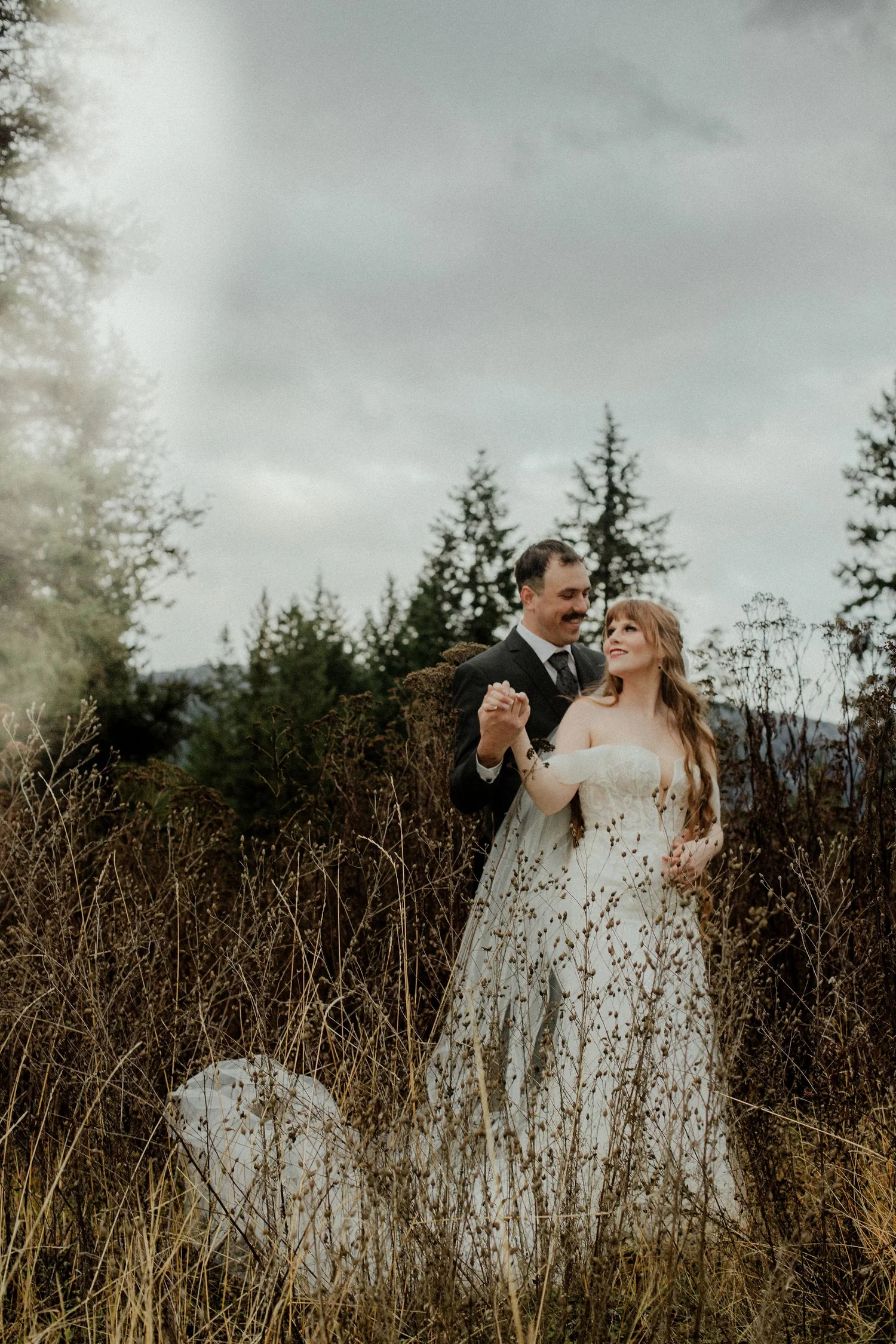 Couple celebrating among the pines